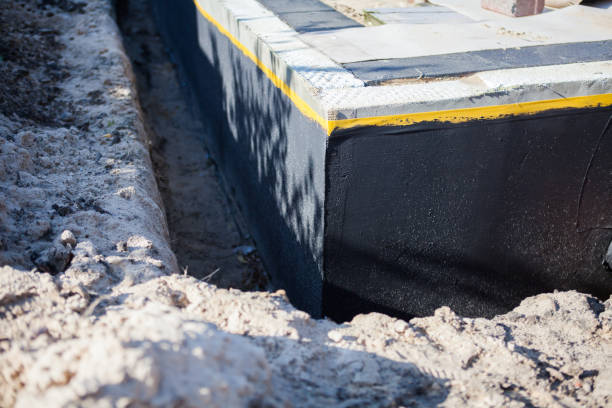 Professional Waterproofing technician working in Arcadia, WI